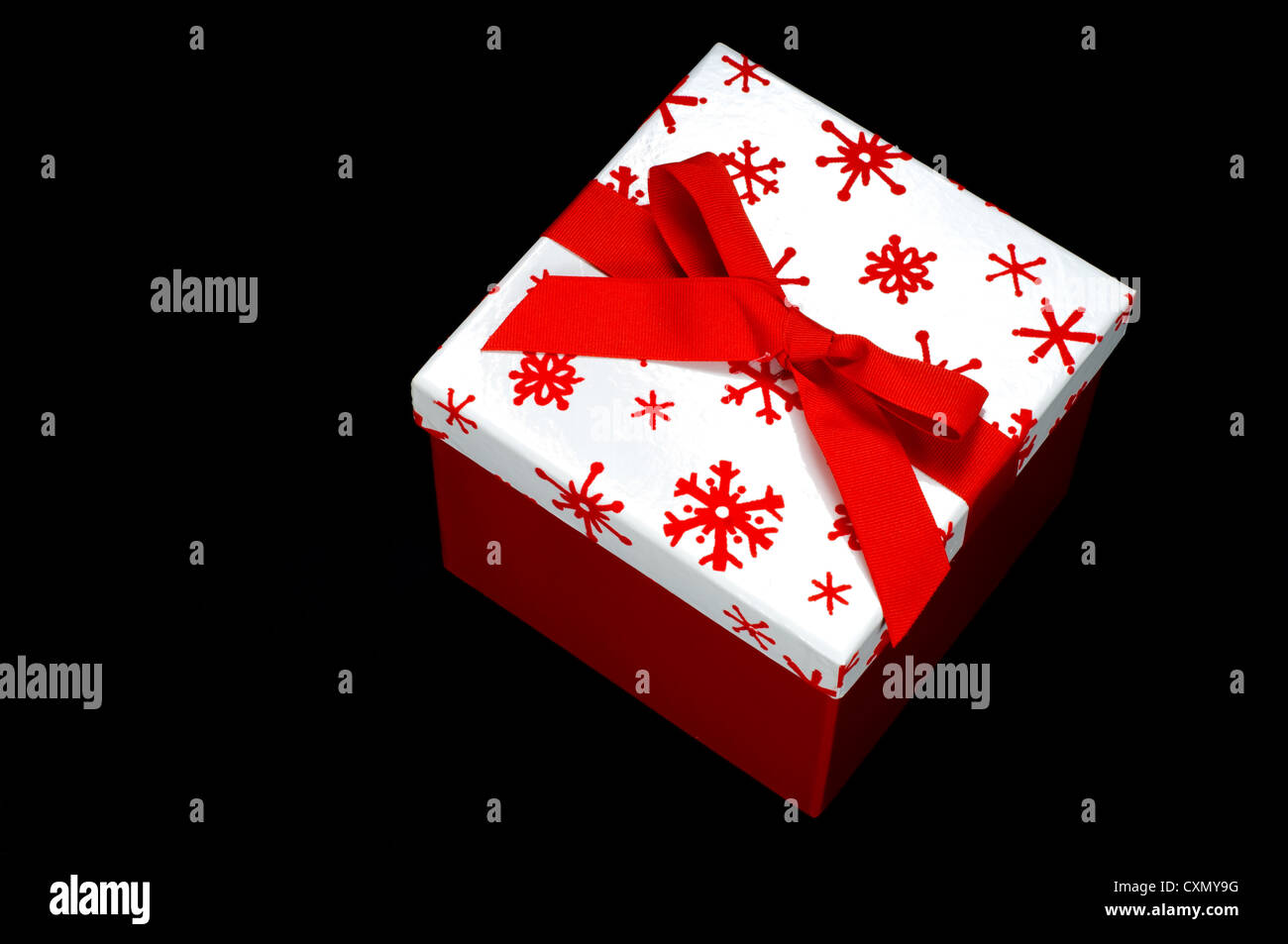 Red and white gift box on black background with copy space Stock Photo ...