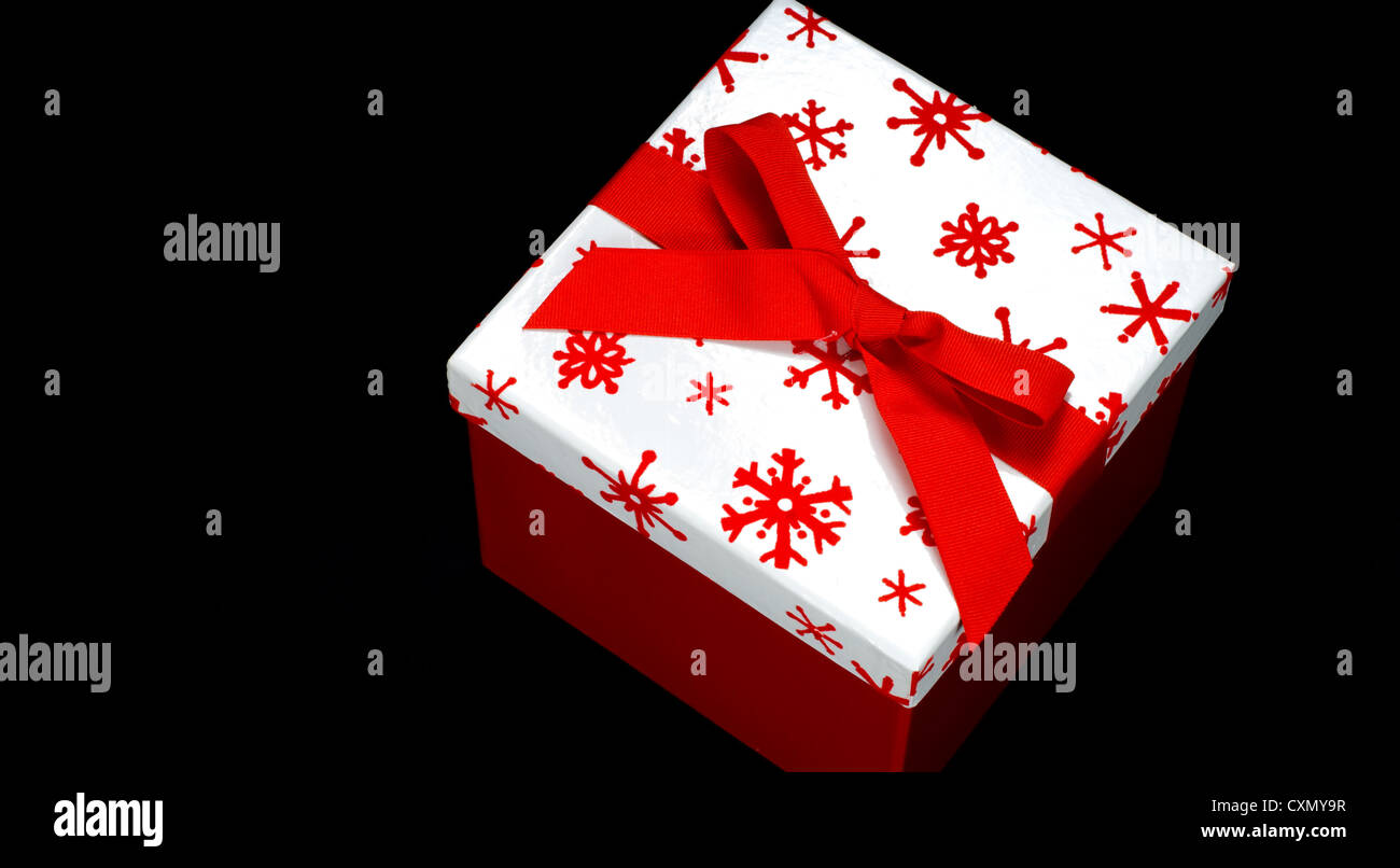 Red and white gift box on black background with copy space Stock Photo ...