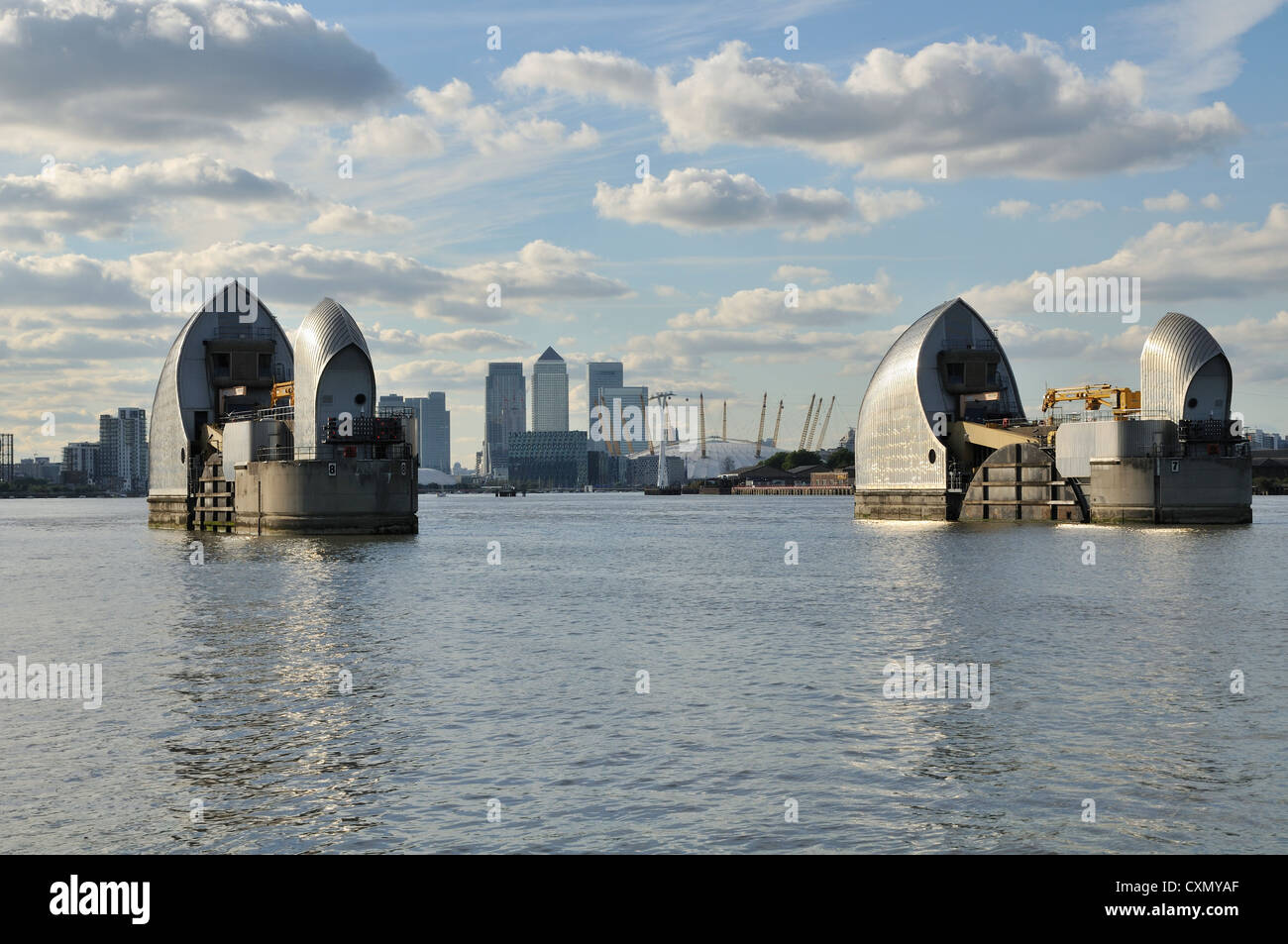 The Thames Barrier, London,UK,  looking downriver towards Canary Wharf and the O2 Arena Stock Photo