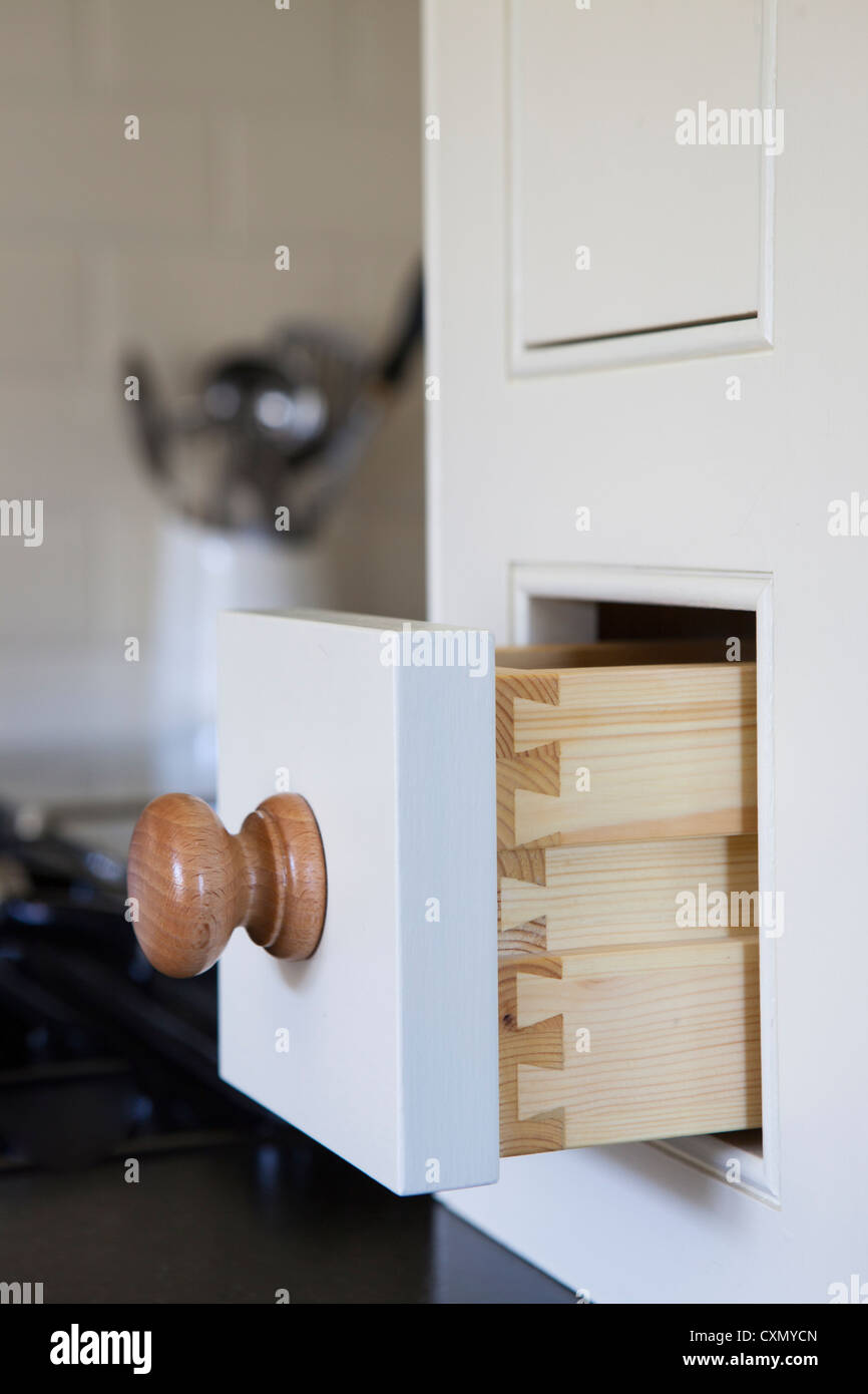 Open drawer in kitchen cupboard Stock Photo Alamy