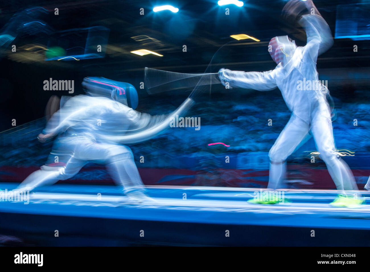 Blurred action of fencing competition. Stock Photo
