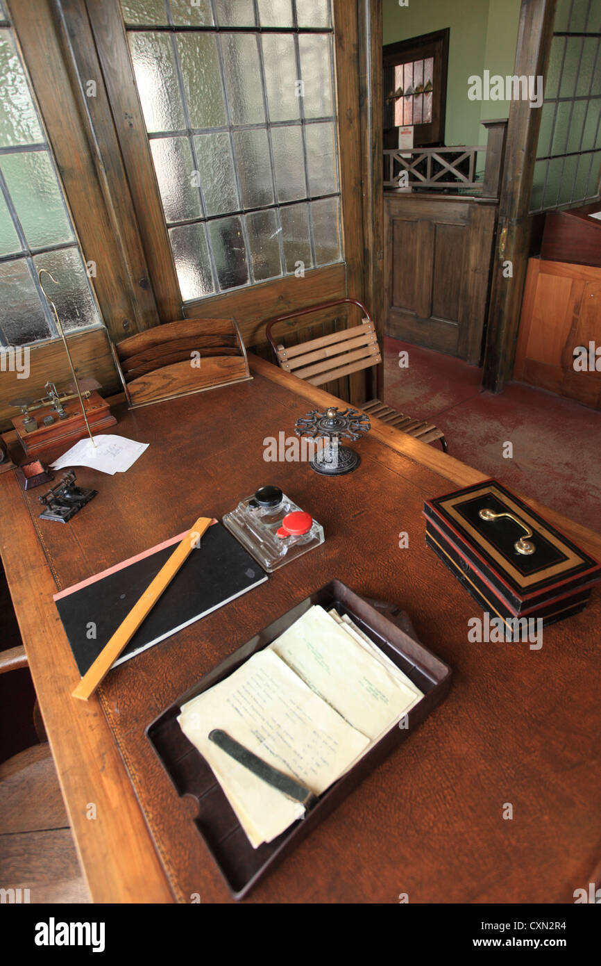 Mid twentieth century office desk with associated office equipment and objects. Stock Photo