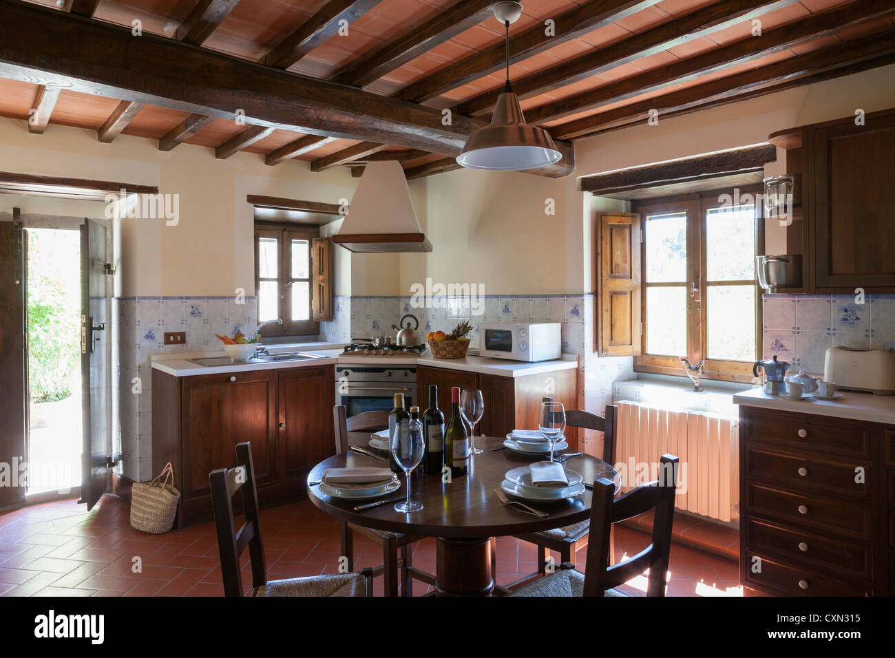 Rustic kitchen in Italian house Stock Photo - Alamy
