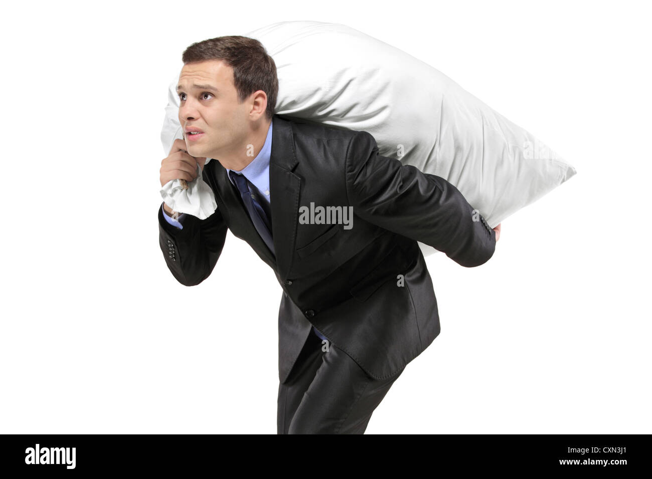 A businessman carrying a money bag isolated on white background Stock ...