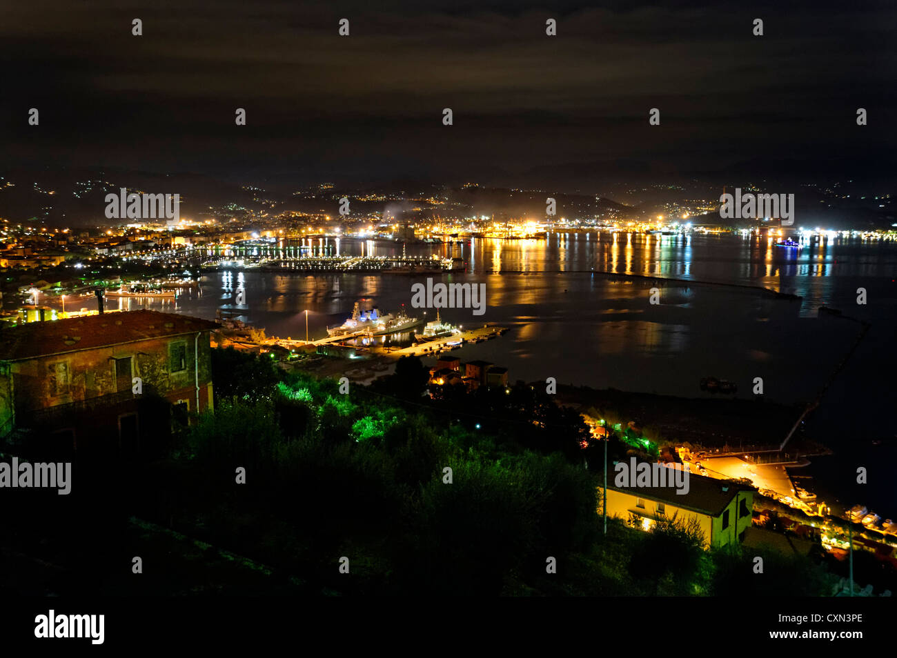La Spezia habour at night, panoramic  view with city lights, naval vessels and coastline Stock Photo