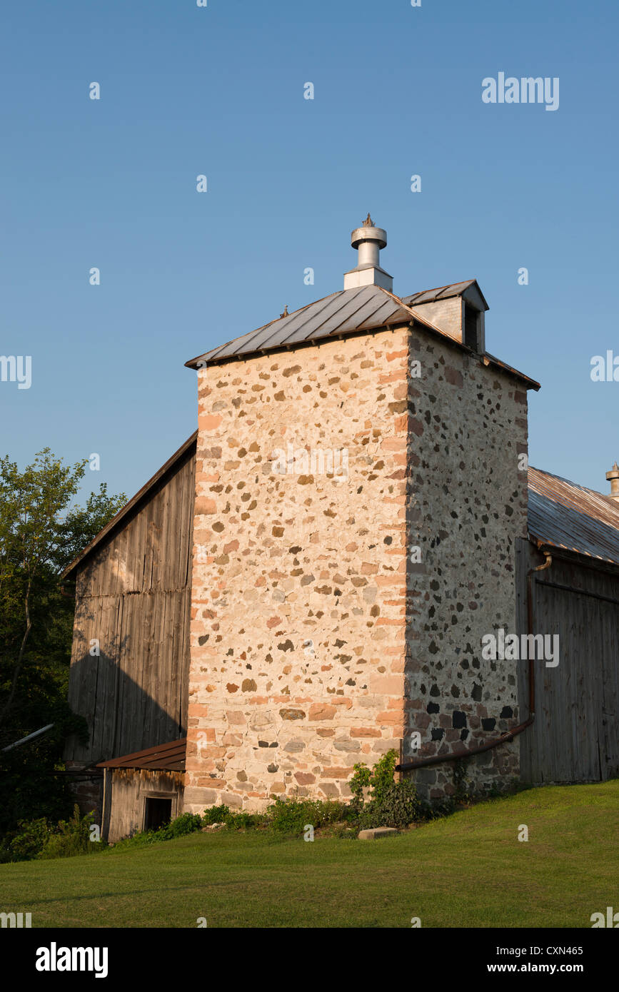 Unusual square silo built of stone. Stock Photo