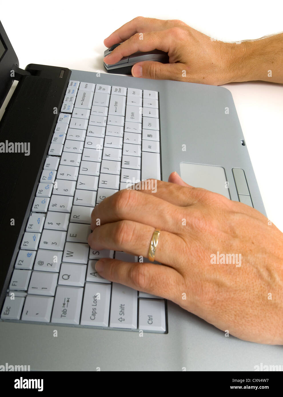 Set of male hands working on gray laptop computer Stock Photo