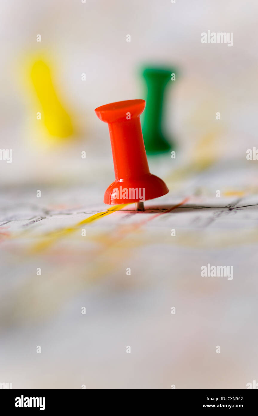 Pushpin on map pinpointing a particular area, map in not ...