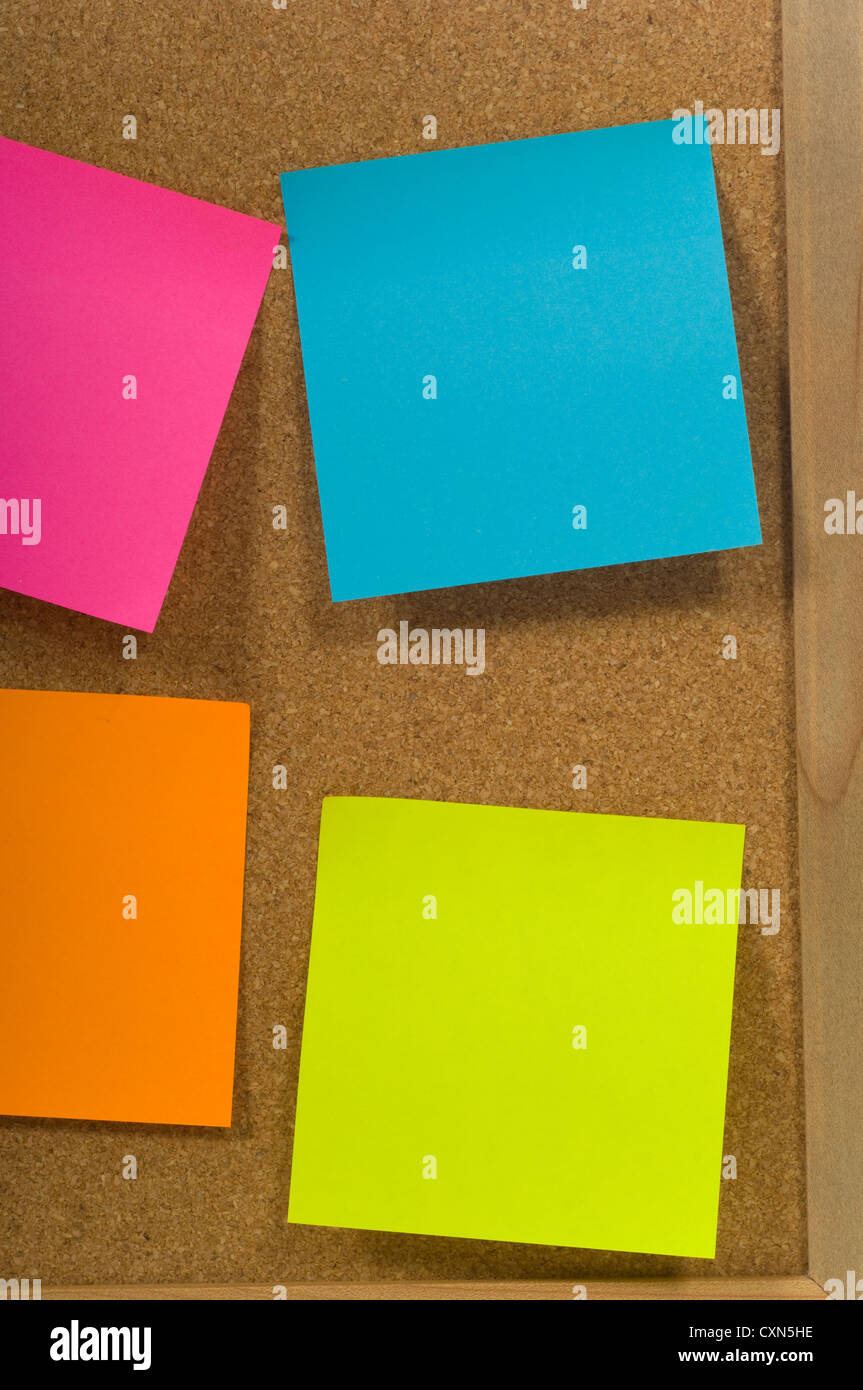 Blank colorful sticky notes or post-its on a cork board or bulletin board  Stock Photo - Alamy