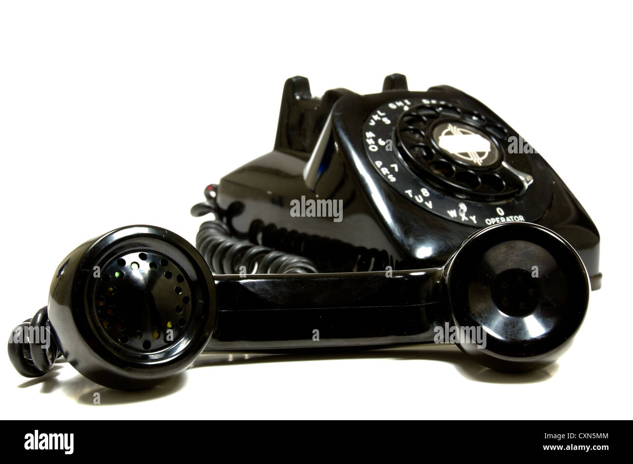 Vintage 1950's telephone with the receiver off the hook, on white