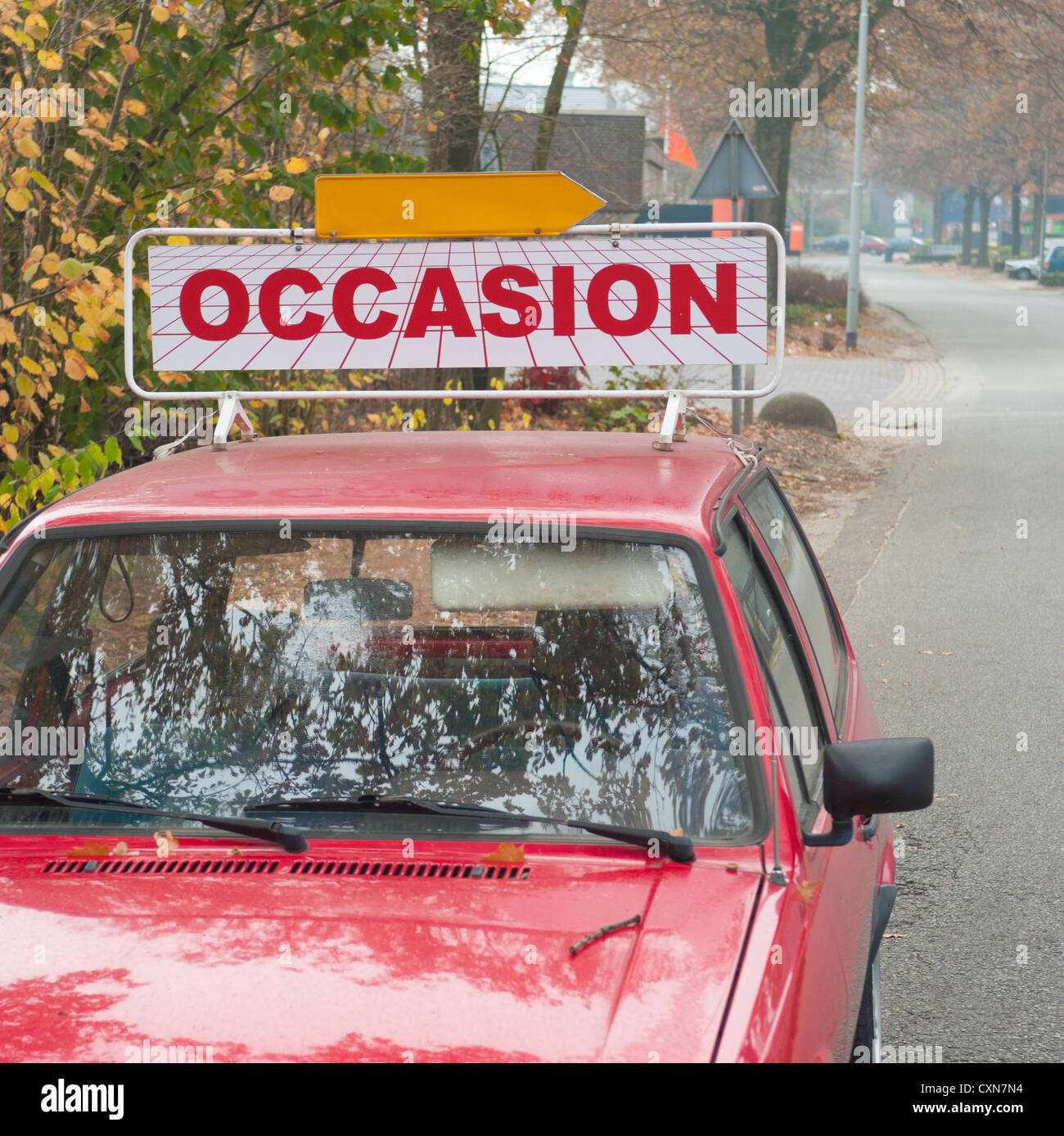 car with an 'occasion' shield on top Stock Photo