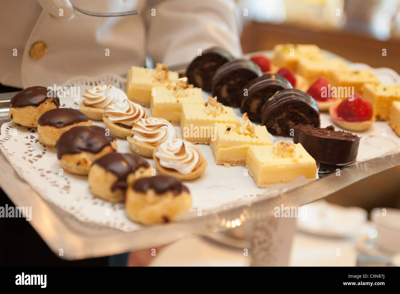 Serving Afternoon tea in the Queens Room. Cunard Liner "Queen Victoria" at sea Stock Photo Alamy