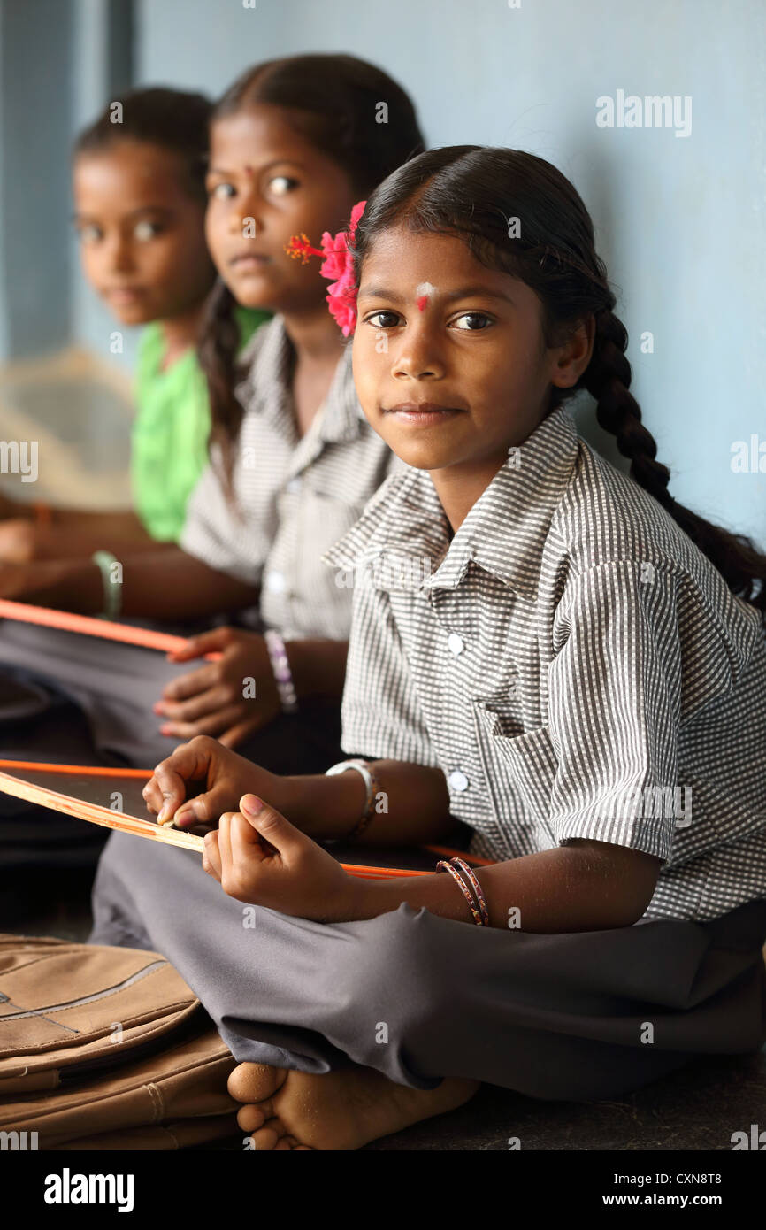 Indian school children writing in their notebooks Andhra Pradesh South India Stock Photo