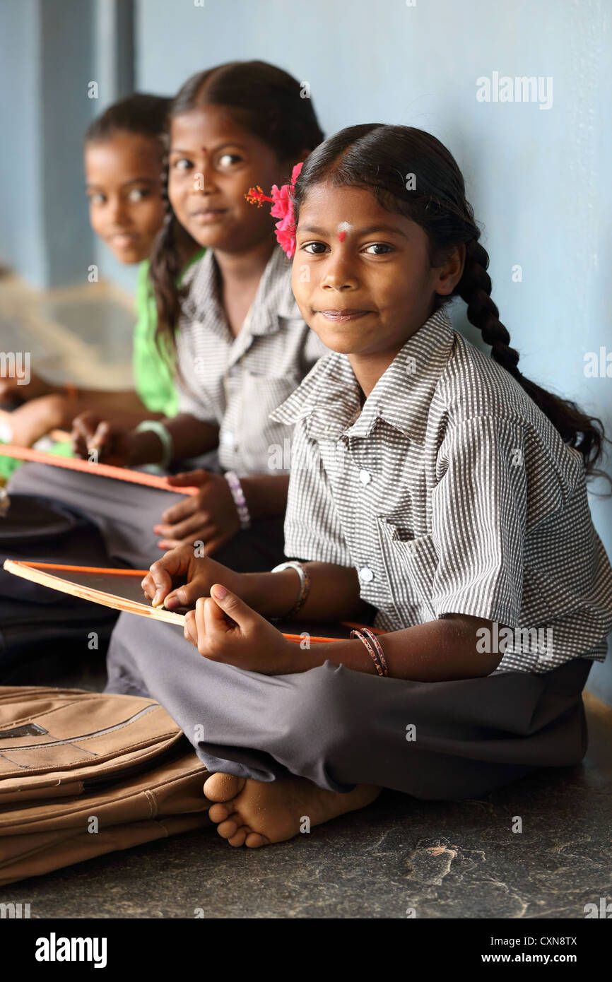 Indian school children writing in their notebooks Andhra Pradesh South India Stock Photo