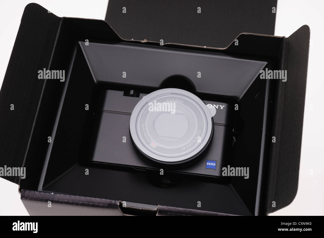 High-end Sony Cyber-shot DSC-RX100 large sensor zoom compact digital camera 20 megapixels. Sealed inside packaging. Stock Photo