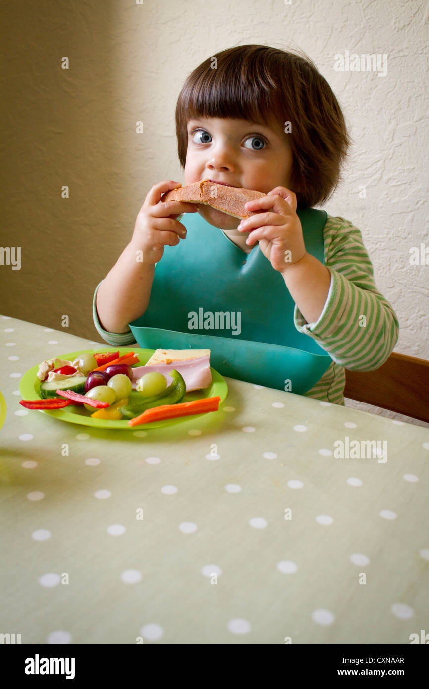Four year old girl eating Stock Photo - Alamy