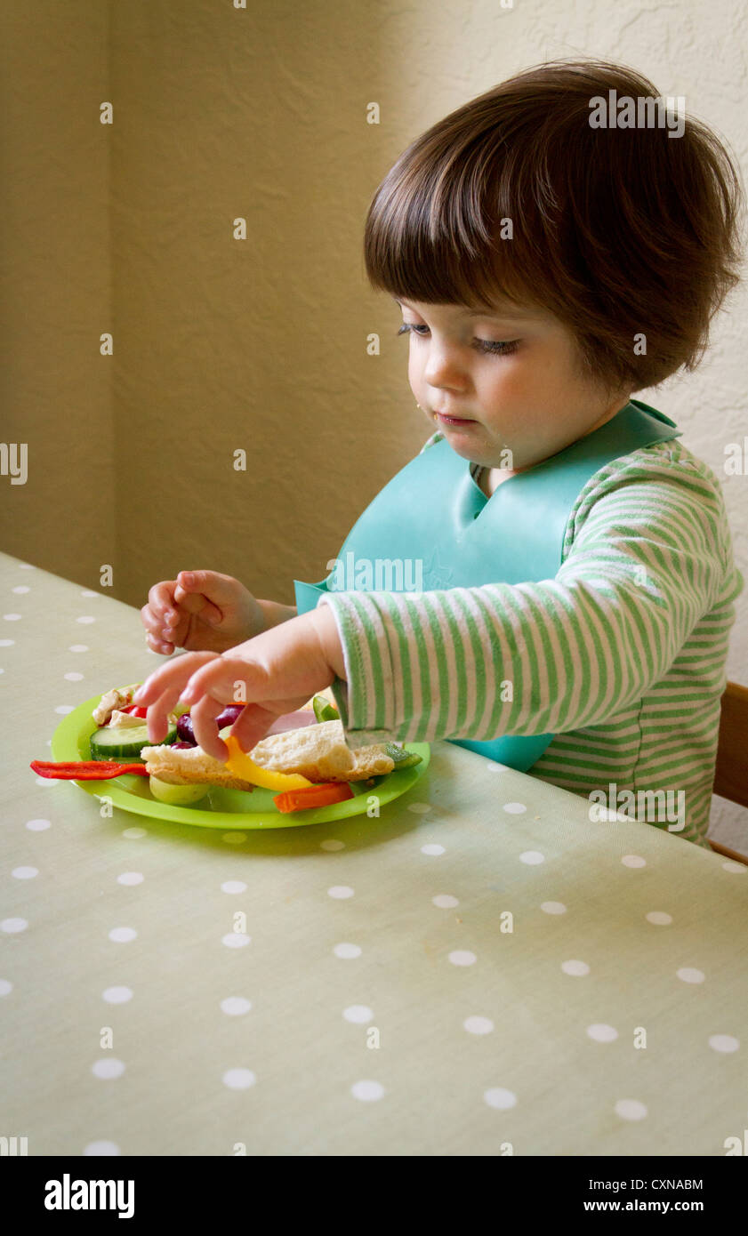 Four year old girl eating Stock Photo - Alamy