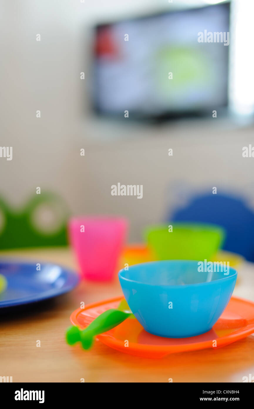 Colourful childrens plates, cup and cutlery Stock Photo Alamy
