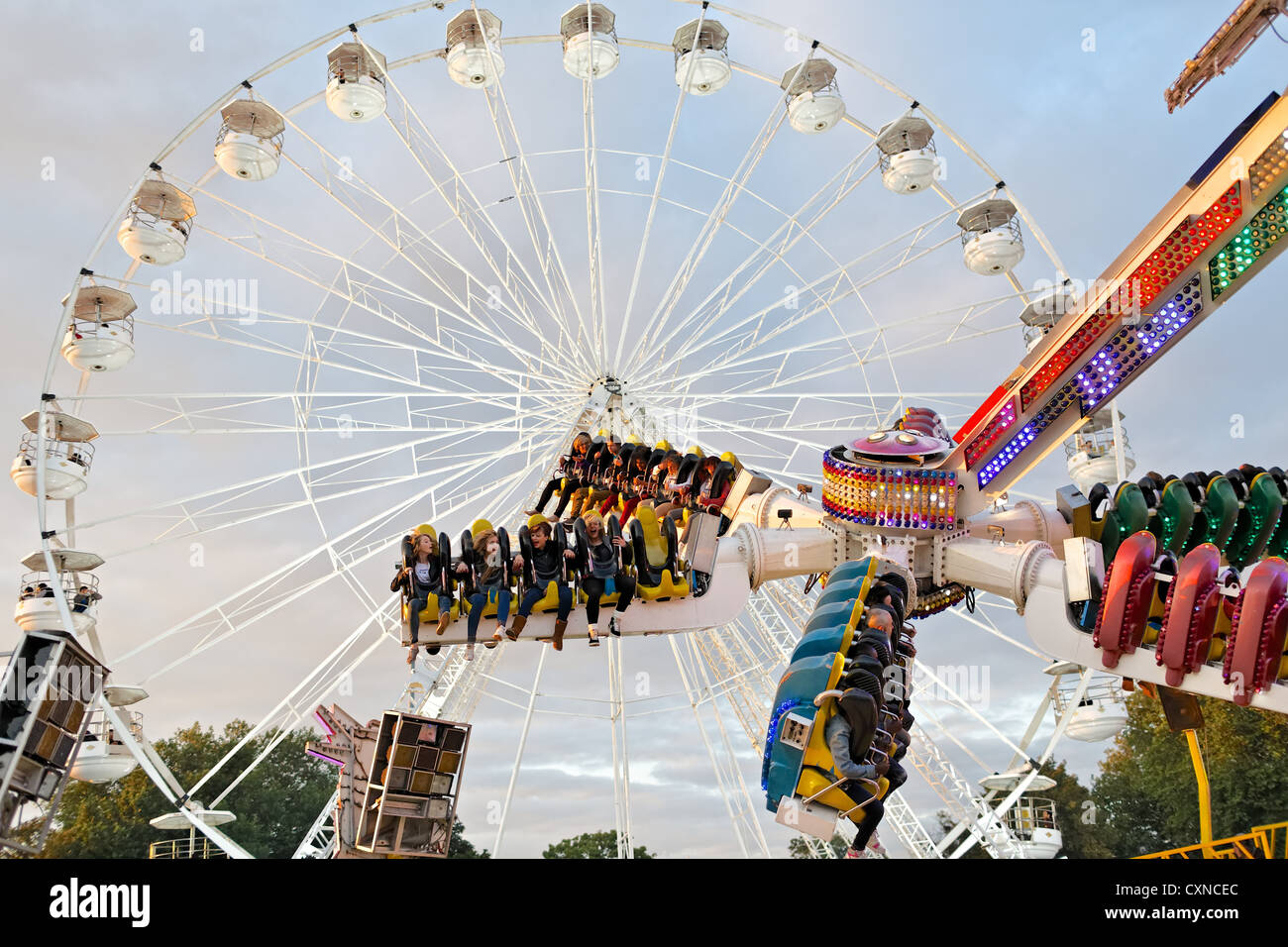 People riding  on the Top Buzz fairground ride at  Nottingham's  historic Goose Fair. Stock Photo