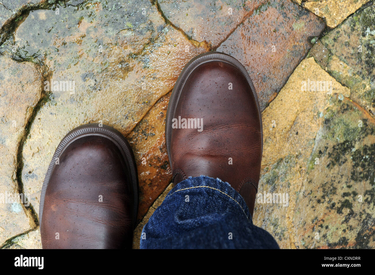 Brown leather Doc Dr Martens boots and blue jeans fashion footwear Stock  Photo - Alamy