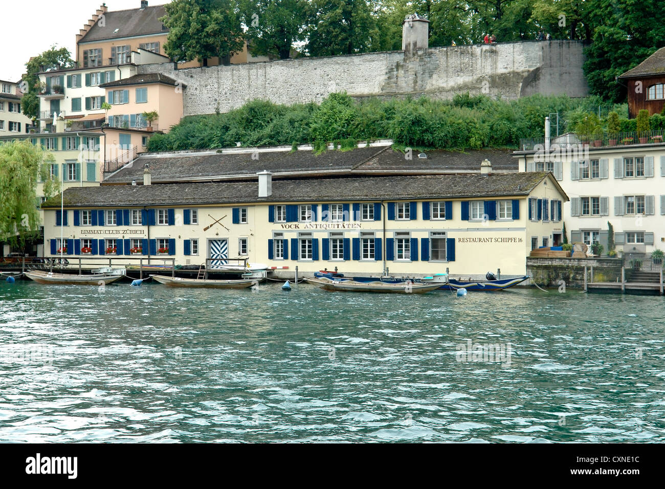 Building on the banks of River Limmat in Zurich. This was a large building that contained a club, a shop and a restaurant. Stock Photo