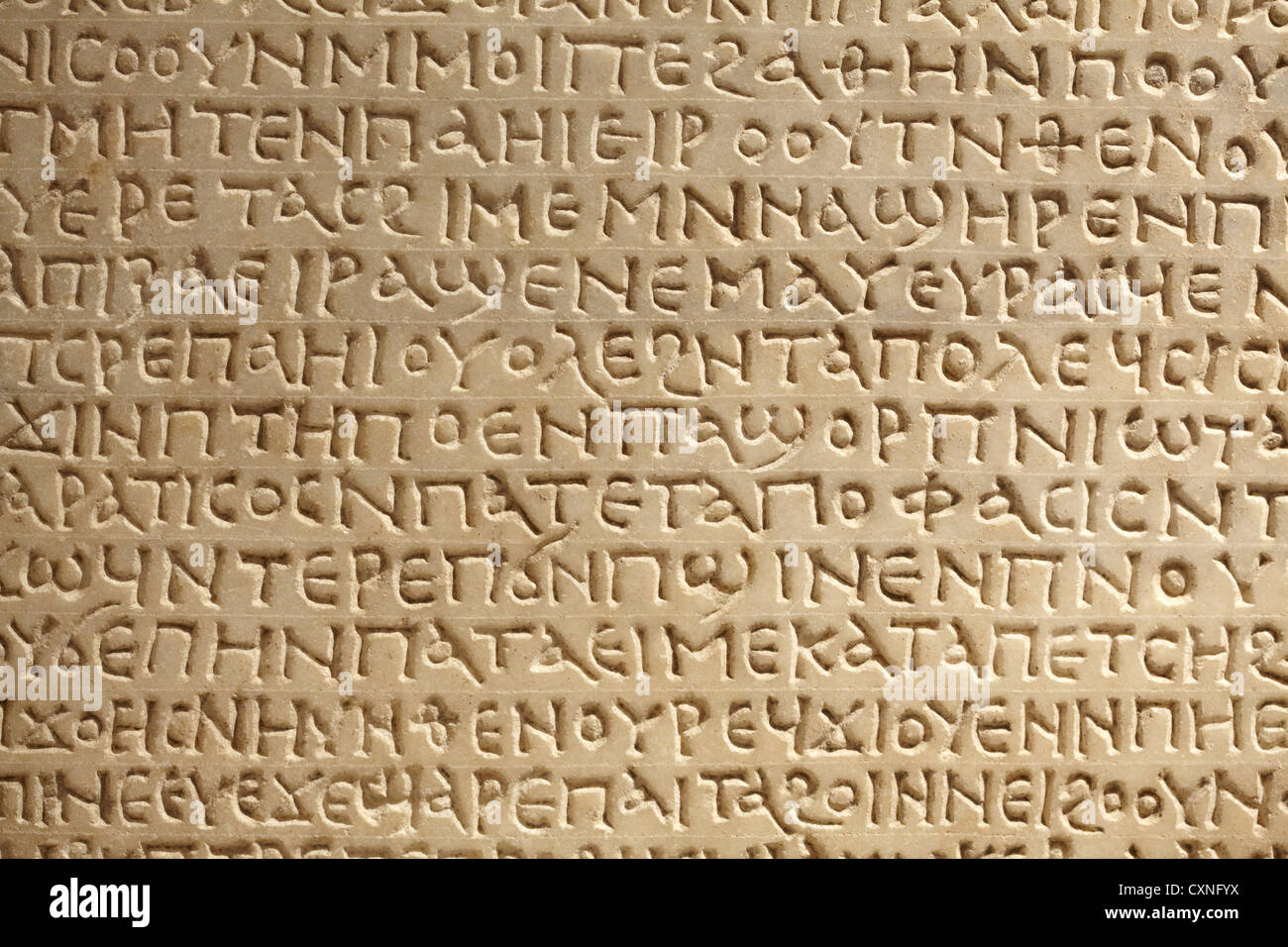 Ancient greek writing on stone background Stock Photo