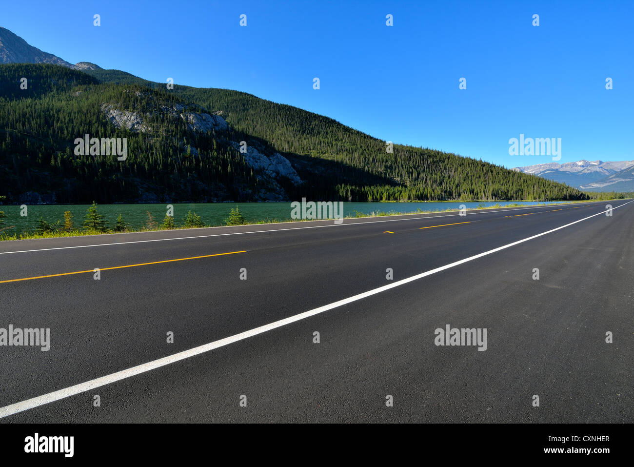 Highway 16 in Jasper National Park showing mountains , lakes, blue sky,and new pavement, Stock Photo