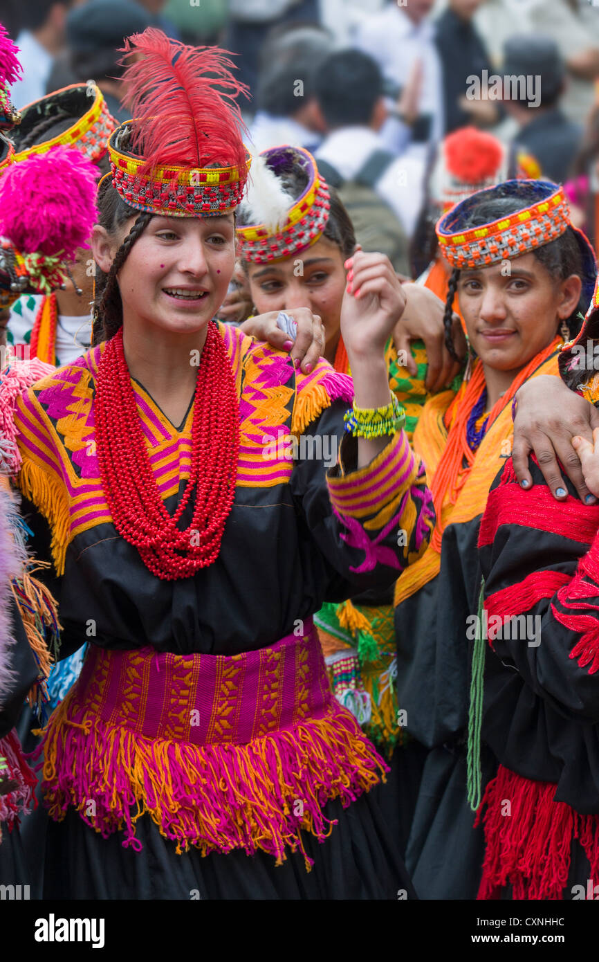 Kalash girls in traditional dress at the Anish Brun Village Charso (dancing ground), Kalash Joshi (Spring Festival), Bumburet Valley, Chitral, Khyber-Pakhtunkhwa, Pakistan Stock Photo