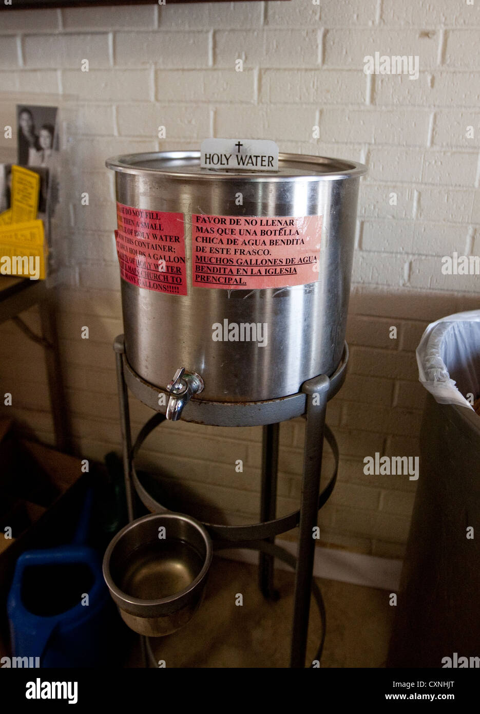 Stainless steel container with Holy Water inside a chapel at Catholic Church in Austin, Texas Stock Photo