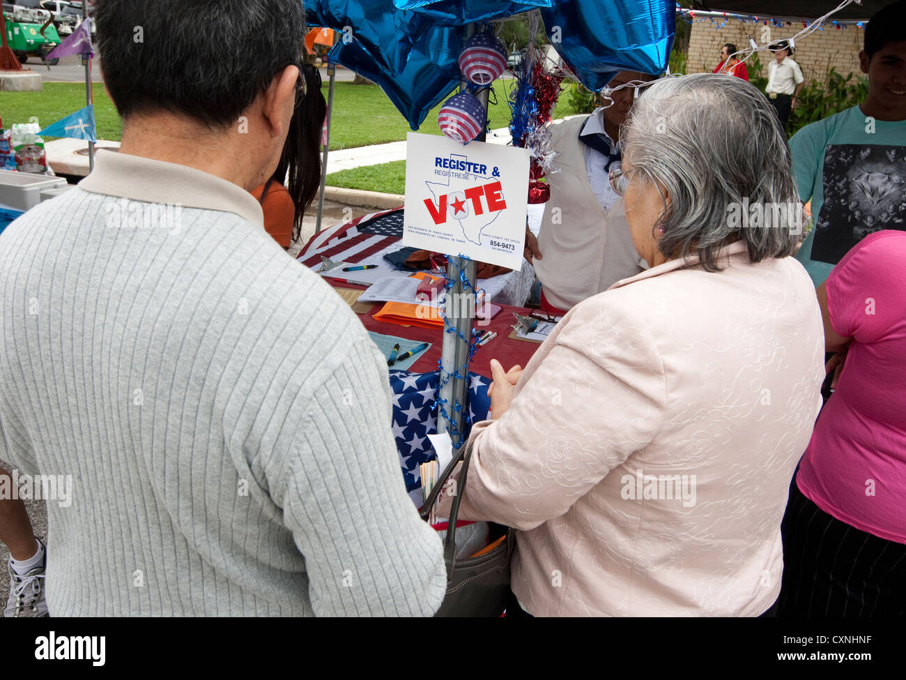 Voter registration booth at an outdoor church festival in Austin, Texas