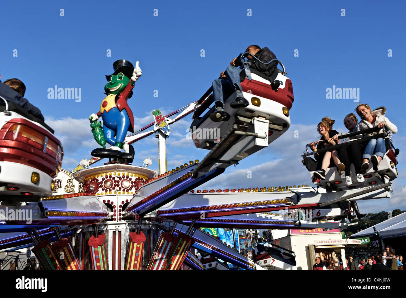 Young people enjoying a fairground ride at Nottingham's historic Goose Fair Stock Photo