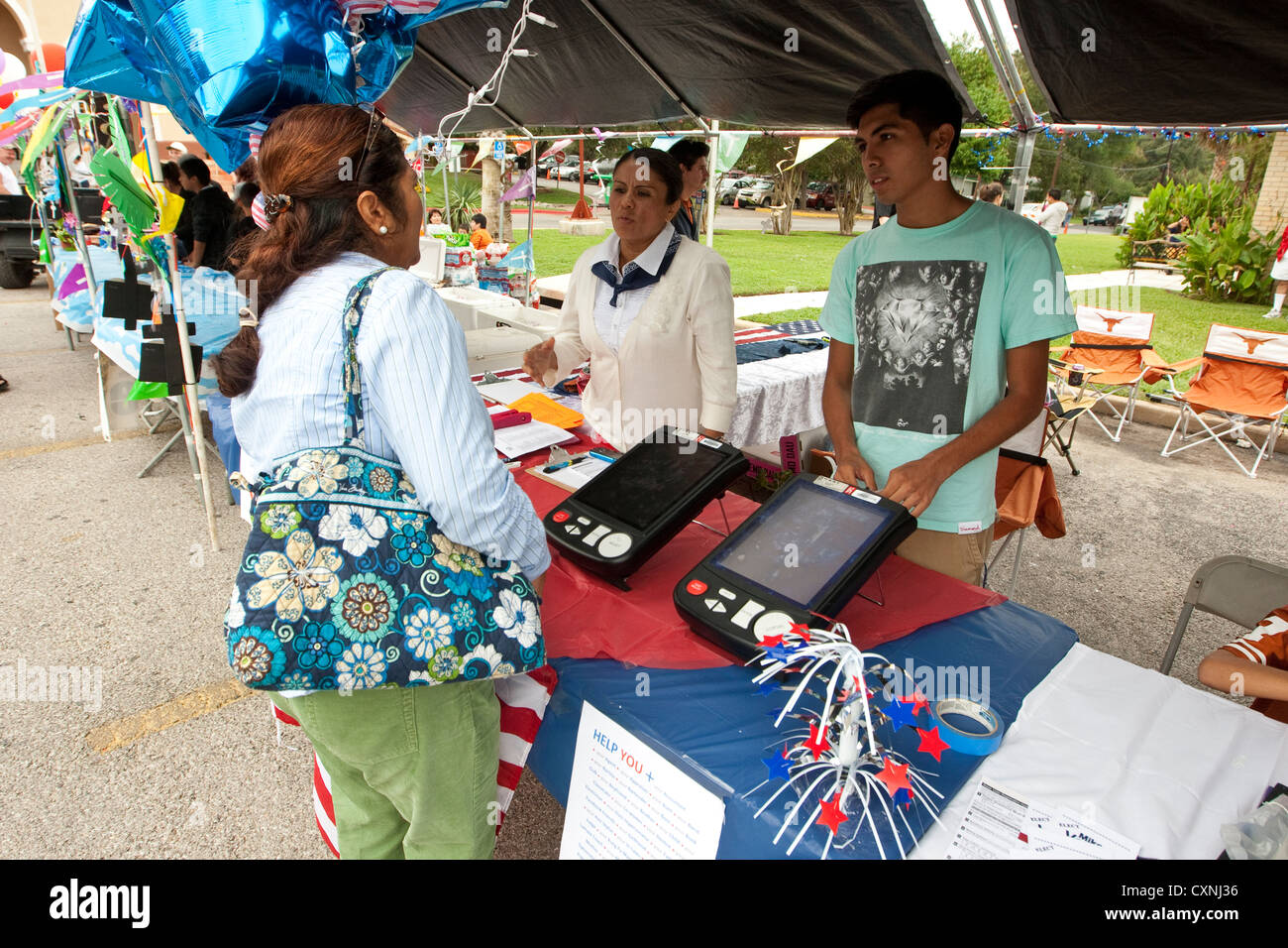 Voter registration booth at an outdoor church festival in Austin, Texas