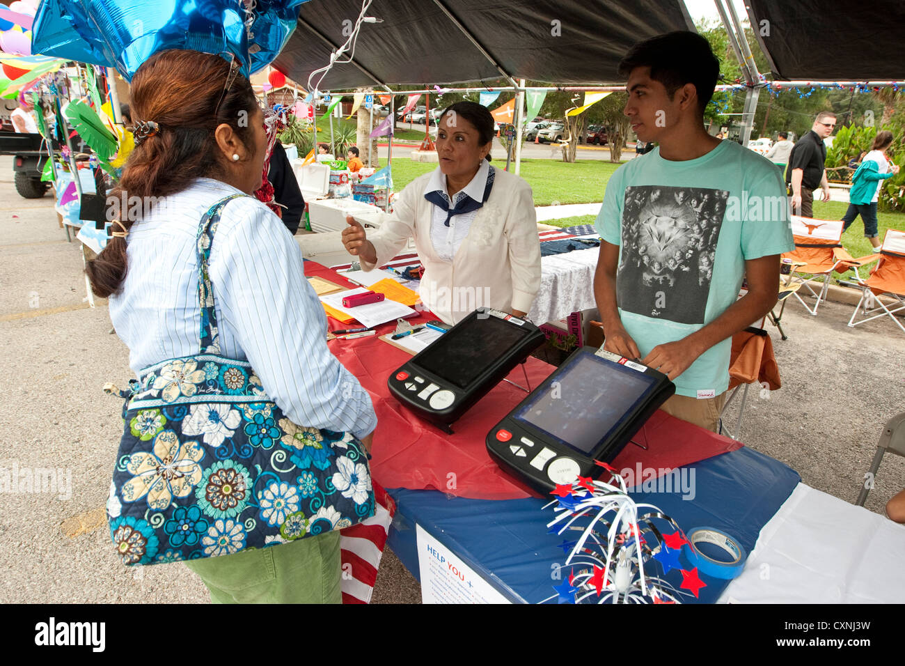Voter registration booth at an outdoor church festival in Austin, Texas