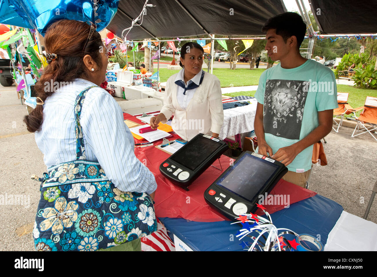 Voter registration booth at an outdoor church festival in Austin, Texas