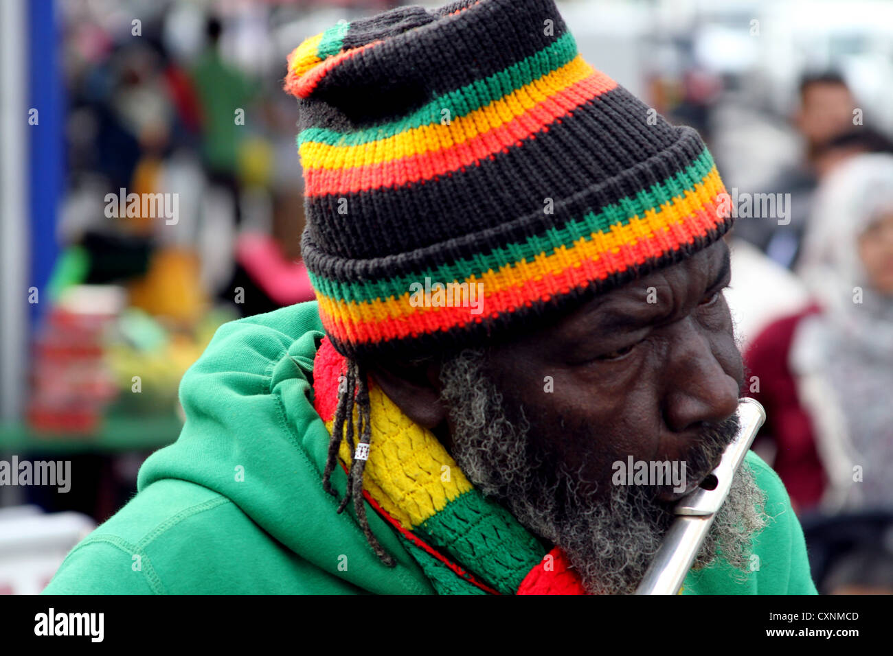 In vibrant rastafarian colours wearing jamaican flag finger ring hires