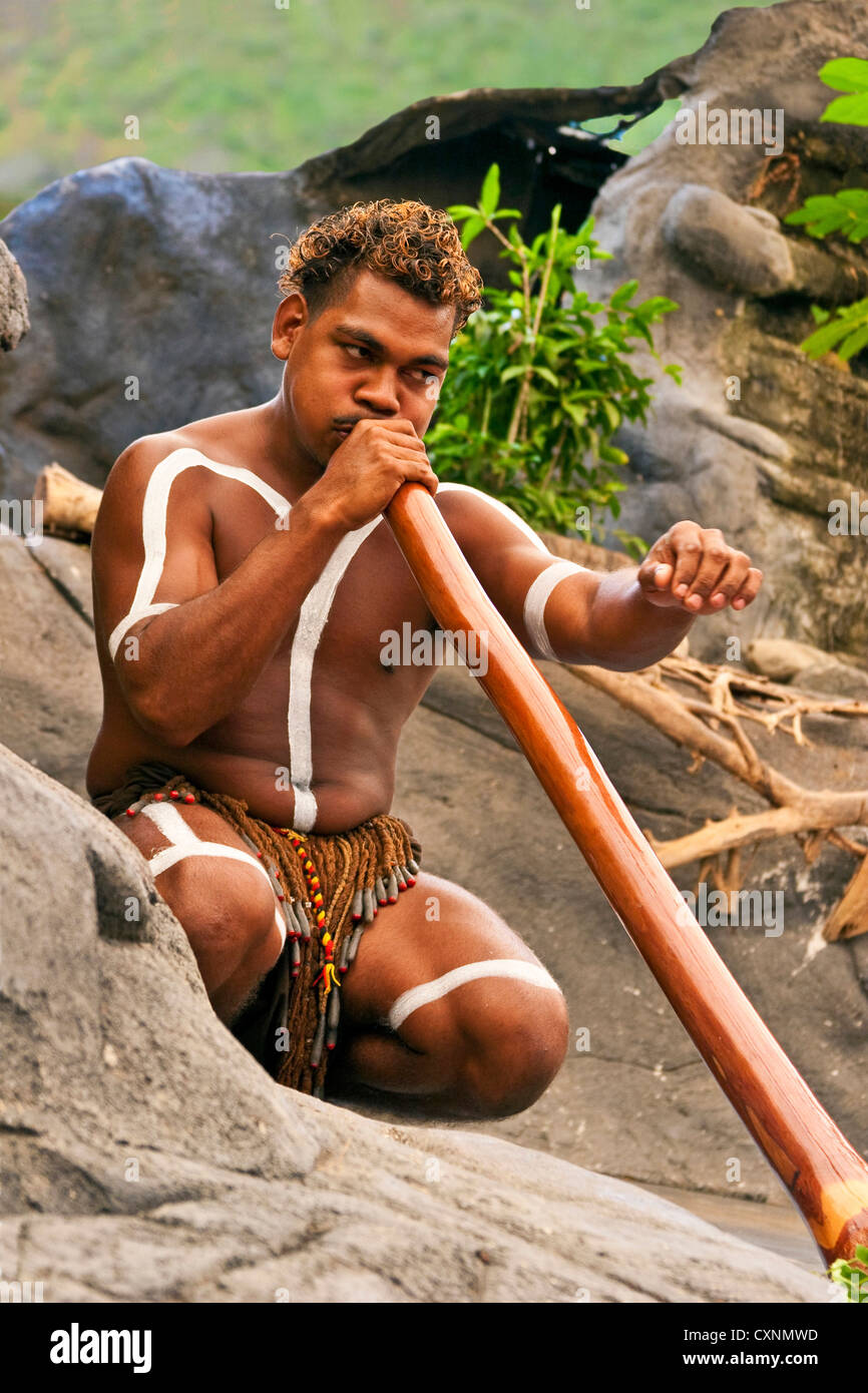 Cairns, Australia, Aborigine man playing a didgeridoo Stock Photo