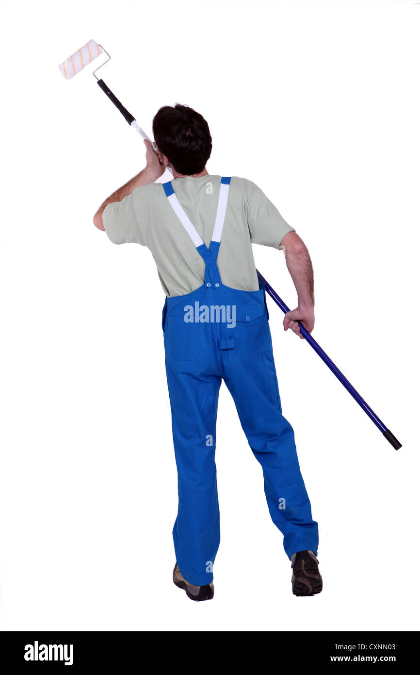 Painter using a paint roller Stock Photo Alamy