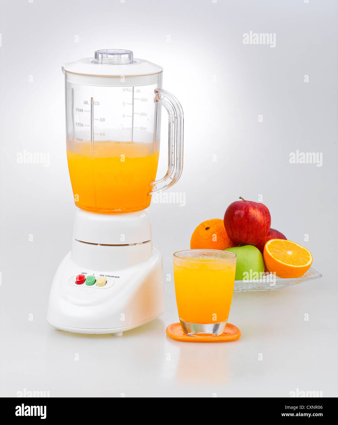 Fruits and orange juice blender machine on clean background Stock Photo Alamy