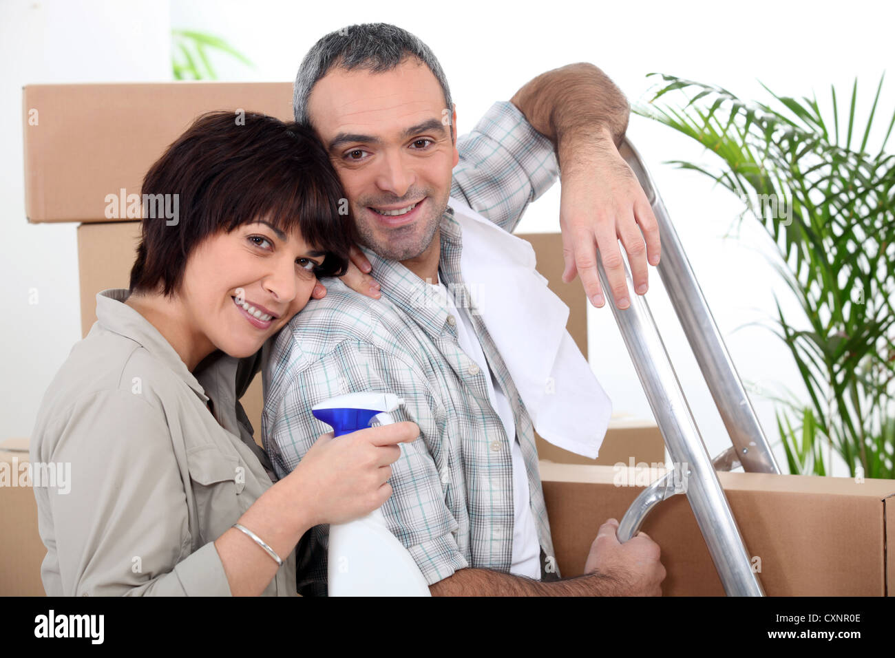Couple moving into new home Stock Photo - Alamy