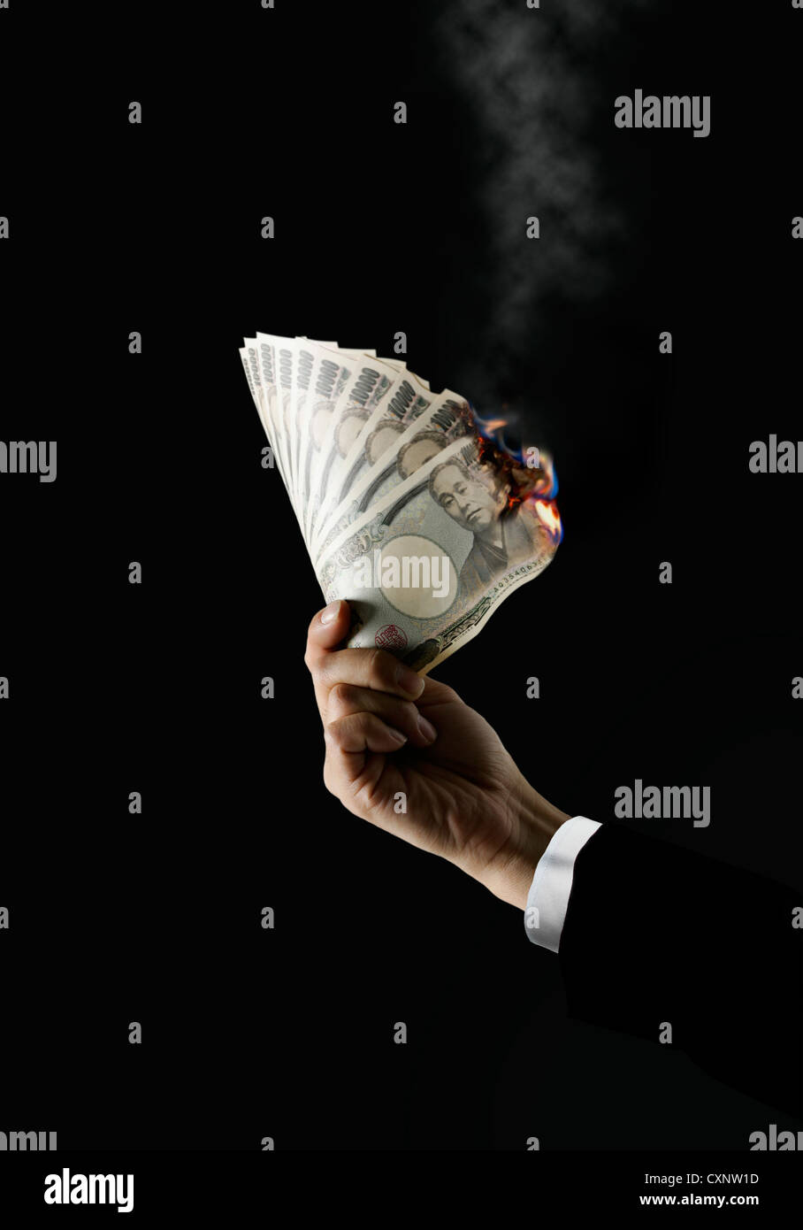 Japanese Bank Notes On Fire Stock Photo