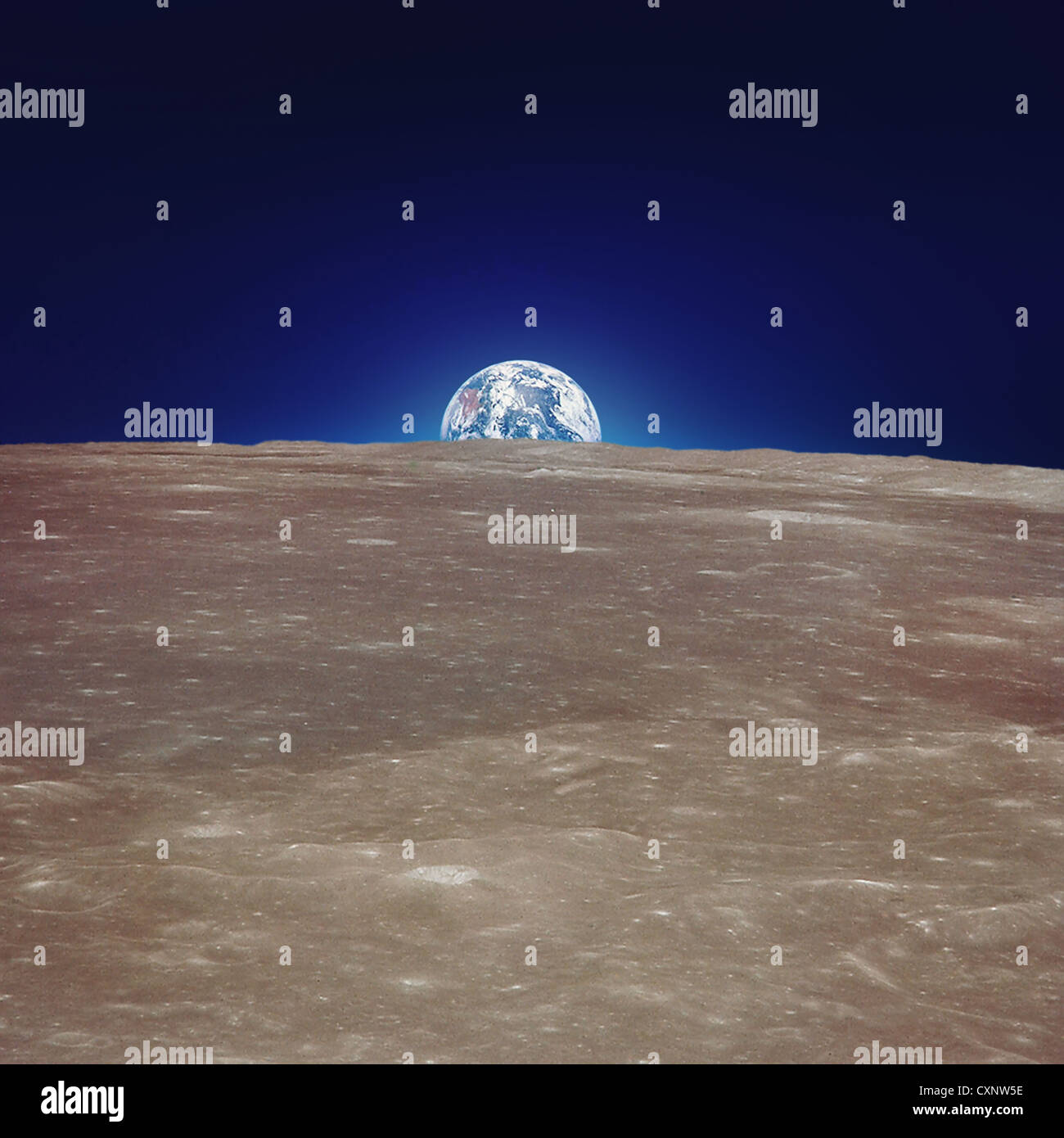 Moon's Surface And Earth Stock Photo