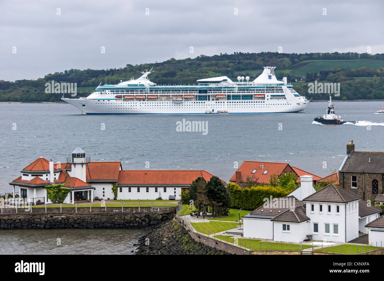 Cruise ship Vision of the Seas anchored in the Firth of Forth in Scotland with North Queensferry in the foreground Stock Photo