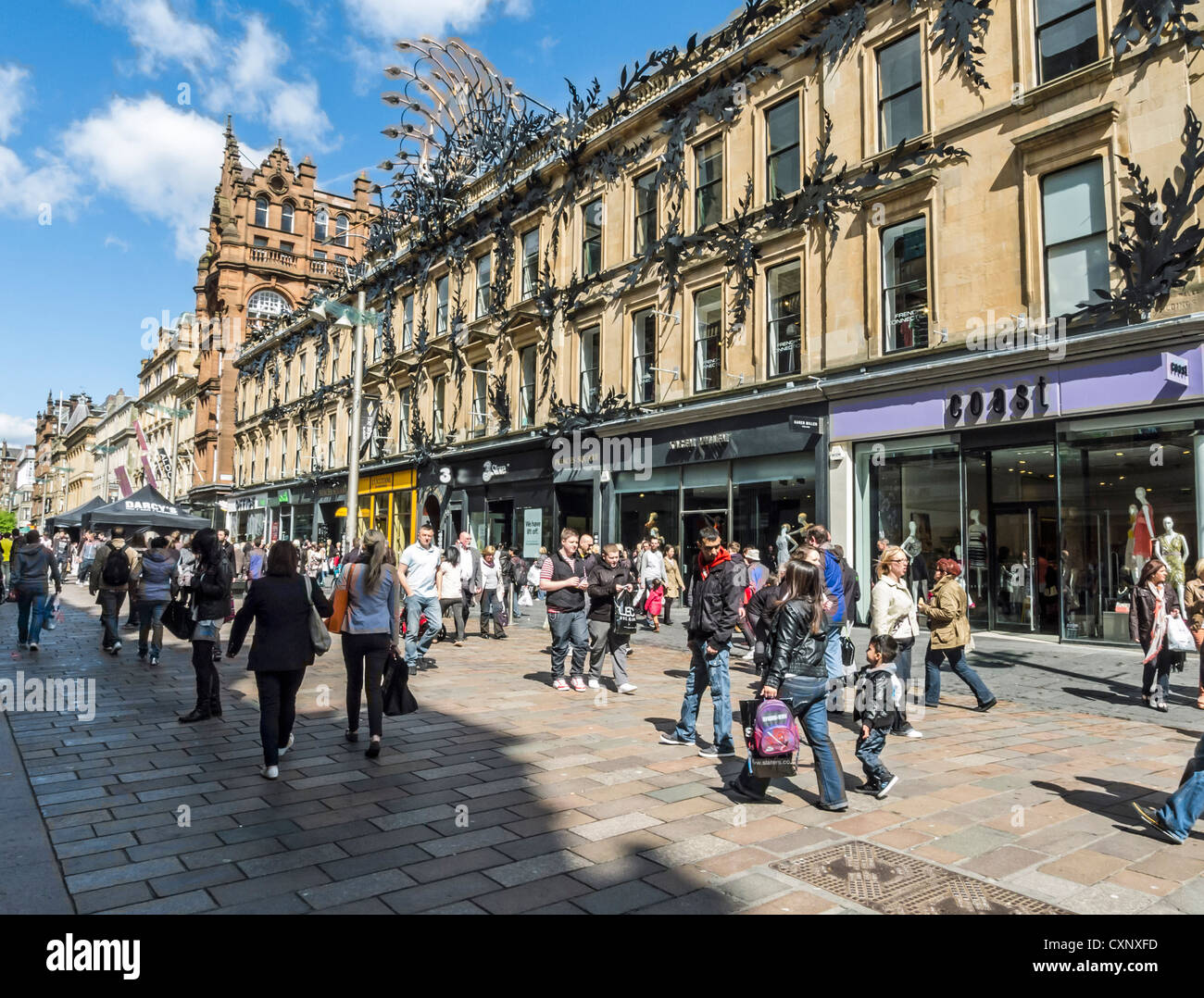 Shoppers and visitors in Buchanan Street in Glasgow Scotland on a sunny