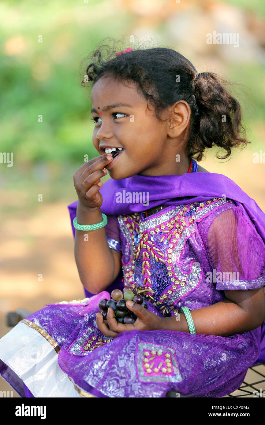 Young Indian girl eating grapes Andhra Pradesh South India Stock Photo ...
