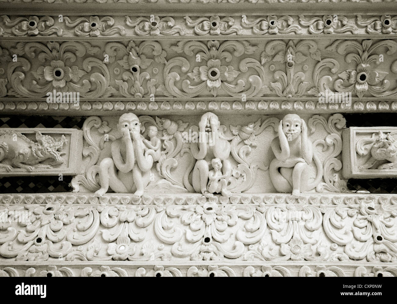 Three wise monkeys in a Buddhist temple in Chiang Mai in Thailand in Far East Southeast Asia. Monkey Culture Art Travel Stock Photo
