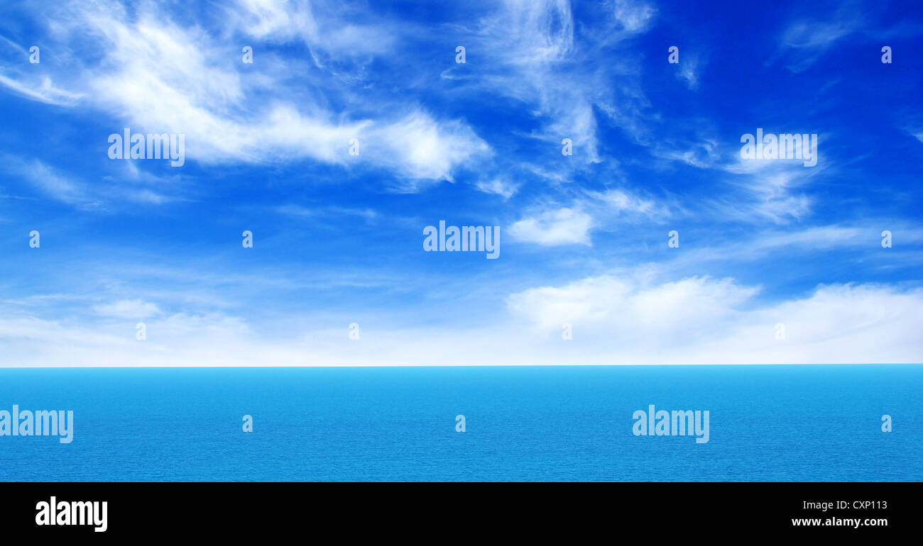 cloudy blue sky above a surface of the sea Stock Photo - Alamy