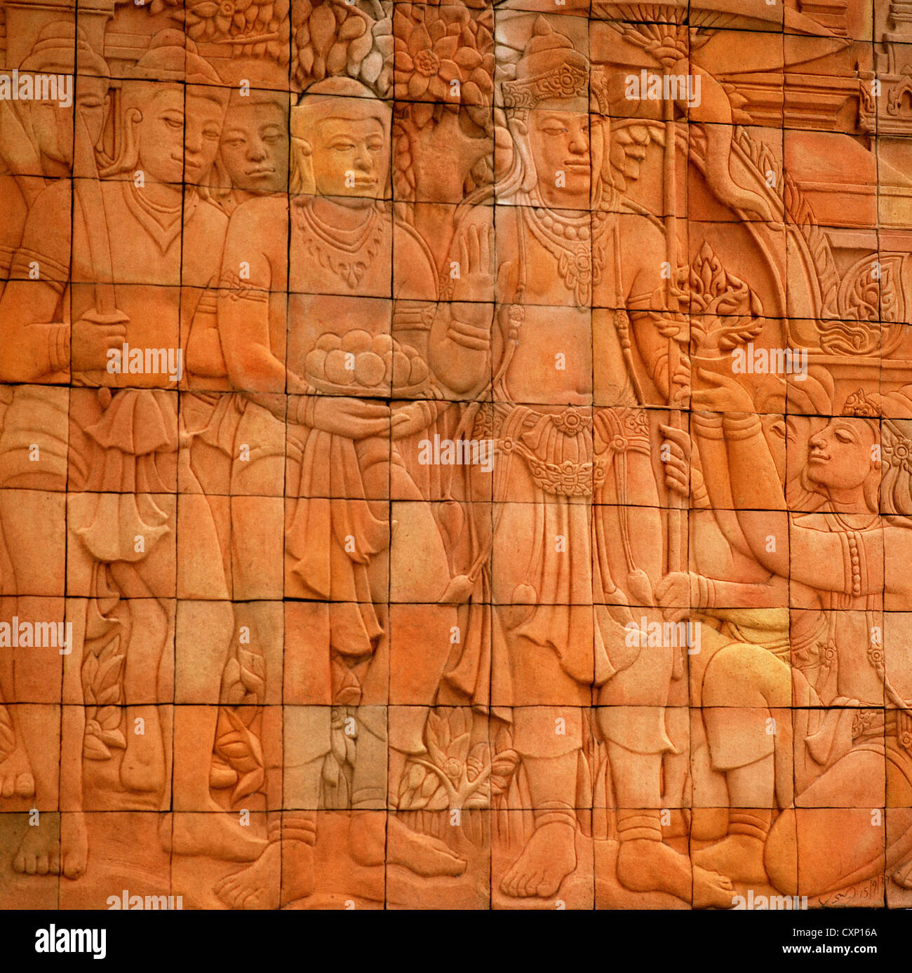 Thai art on a brick wall in Chiang Mai in Thailand in Far East Southeast Asia. History Historic Historical Bas Relief Travel Stock Photo