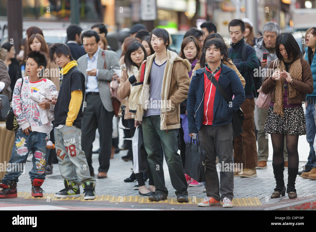 Japanese people waiting for crossing at hachiko crossroad in Shibuya district, Tokyo, Japan Stock Photo