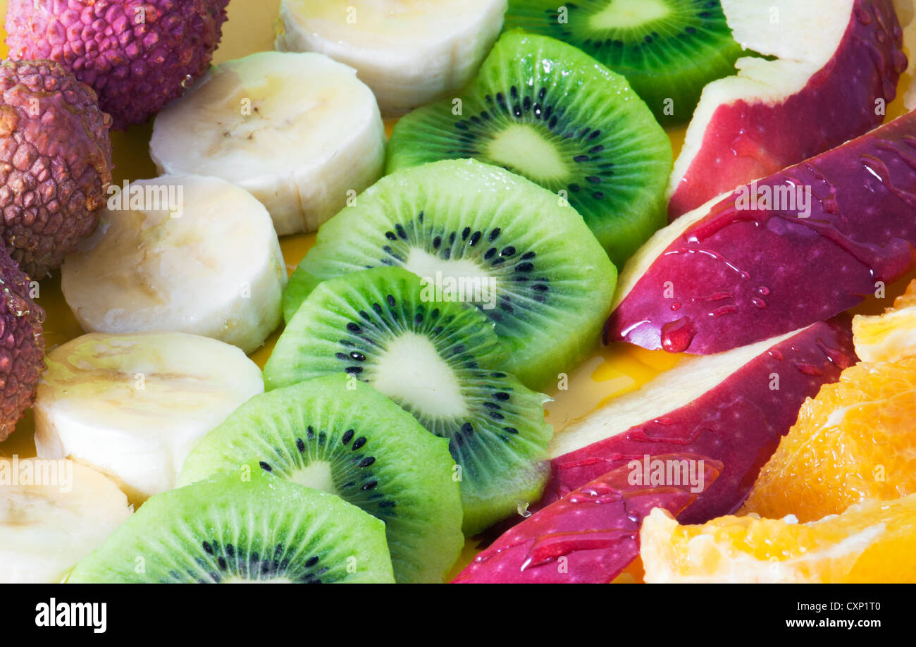 Mix of divers fruit with honey Stock Photo