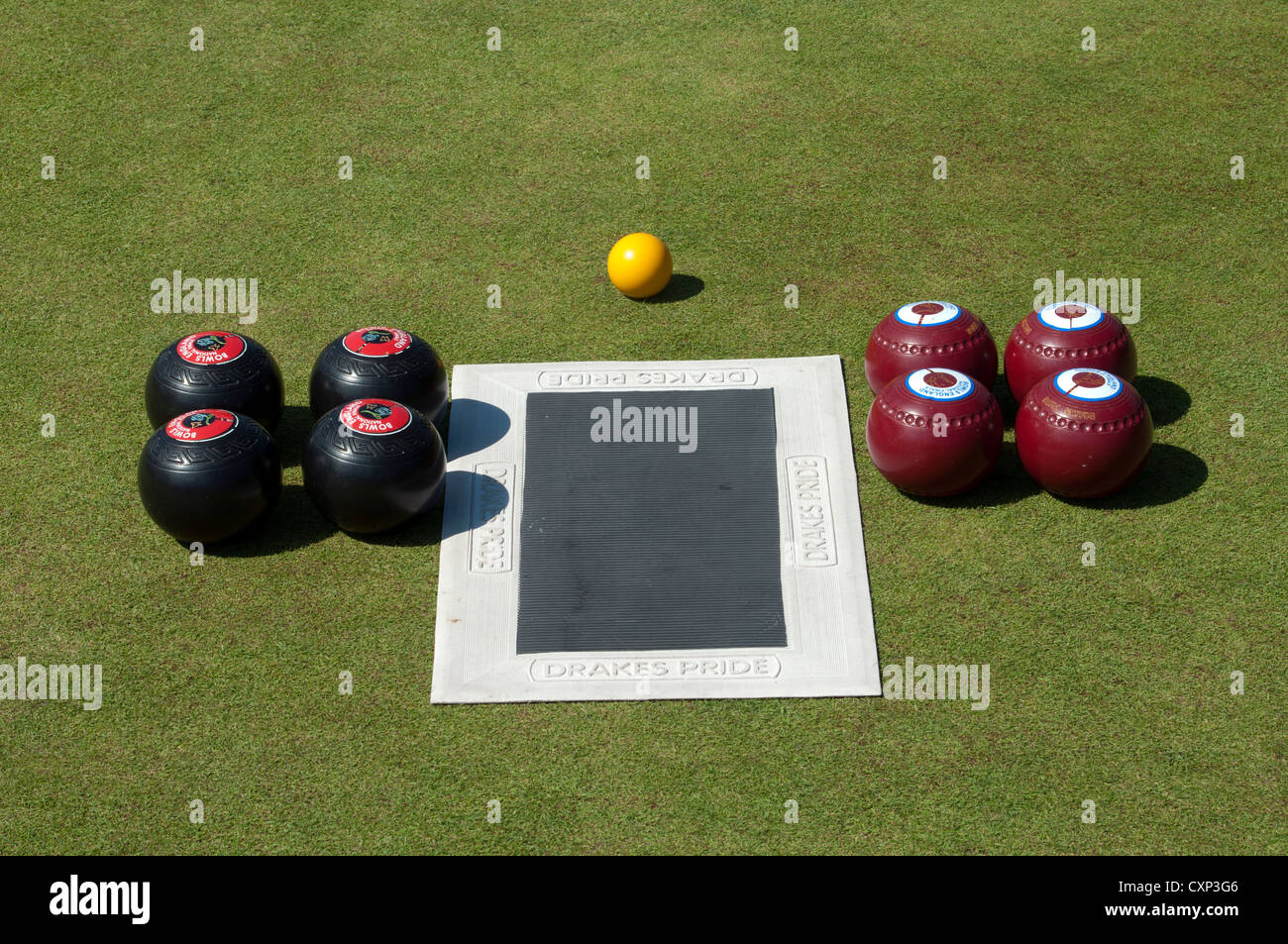 Lawn bowls and mat laid out before a match Stock Photo